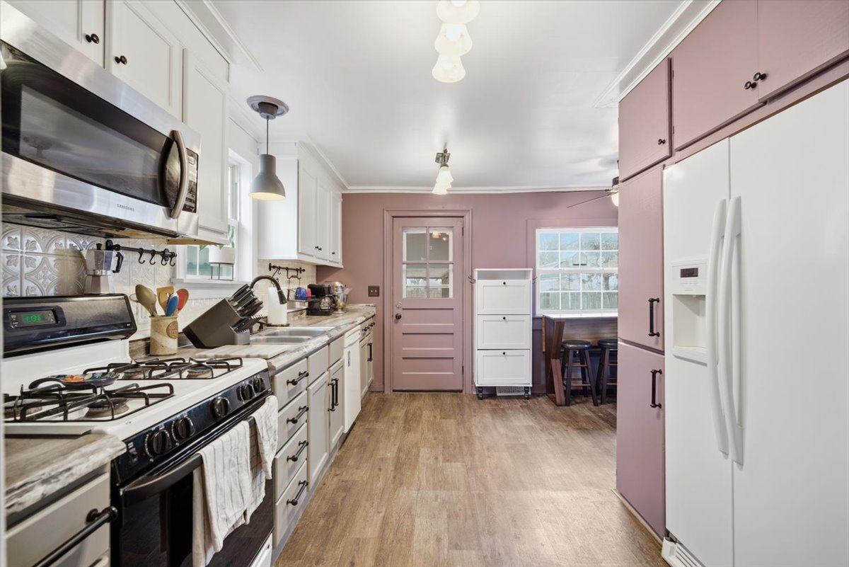 511 East Chestnut Street Bloomington, IL 61701 - Photo 12 of 32 a kitchen with stainless steel appliances a stove a sink and a refrigerator