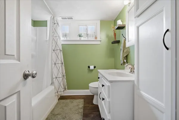 a bathroom with a bathtub and shower