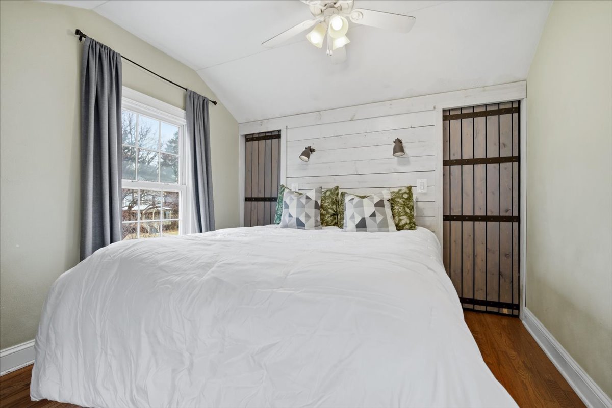 511 East Chestnut Street Bloomington, IL 61701 - Photo 24 of 32 a bedroom with a large bed and a window
