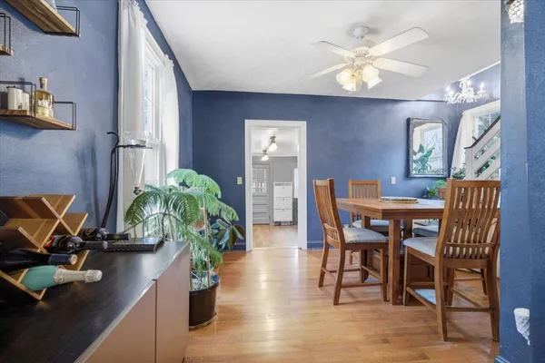 a dining room with furniture and entryway