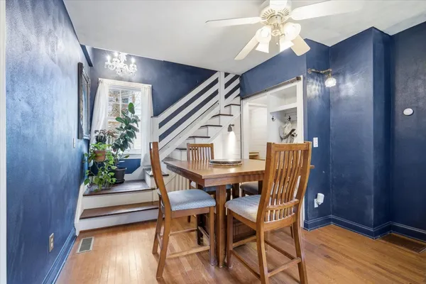 a view of a dining room with furniture window and wooden floor