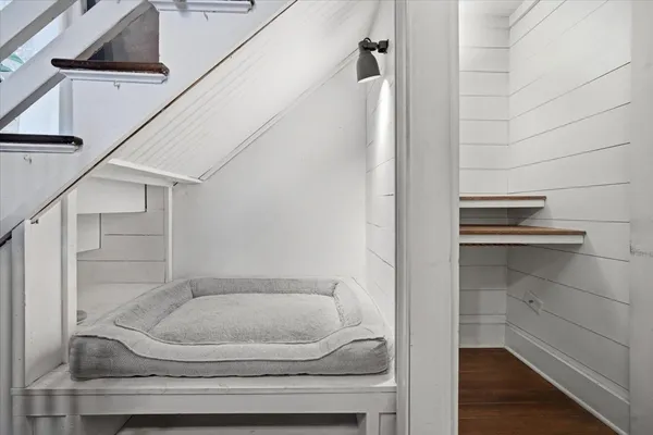 a view of walk in closet with empty racks