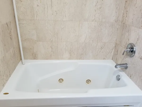 a bathroom with a bath tub