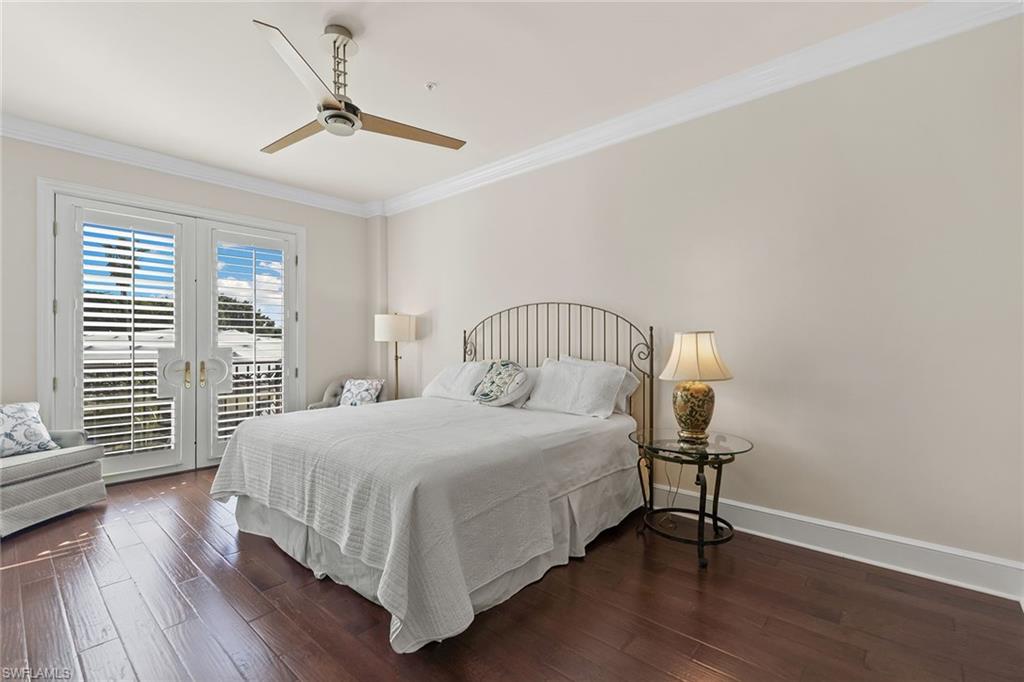 780 5th Avenue South, Unit 306 Naples, FL 34102 - Photo 17 of 31 a bedroom with a bed and a window