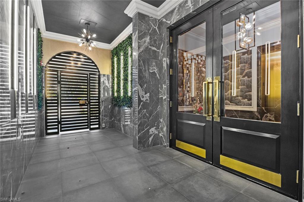 780 5th Avenue South, Unit 306 Naples, FL 34102 - Photo 2 of 31 a view of a hallway with interior of the house