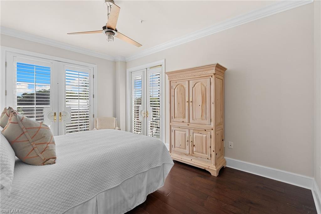 780 5th Avenue South, Unit 306 Naples, FL 34102 - Photo 24 of 31 a bedroom with a bed and a window