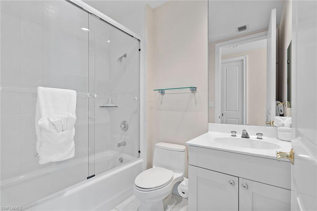 780 5th Avenue South, Unit 306 Naples, FL 34102 - Photo 25 of 31 a bathroom with a sink a toilet and shower