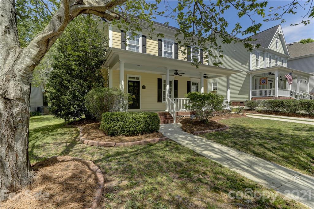 548 Glen Walk Drive Fort Mill, SC 29708 - Photo 2 of 48 a front view of a house with garden