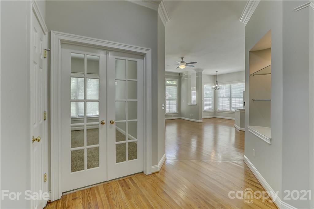 548 Glen Walk Drive Fort Mill, SC 29708 - Photo 12 of 48 a view of an empty room with wooden floor and a window