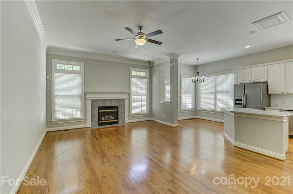 548 Glen Walk Drive Fort Mill, SC 29708 - Photo 13 of 48 a view of a kitchen with a sink a fireplace and wooden floor