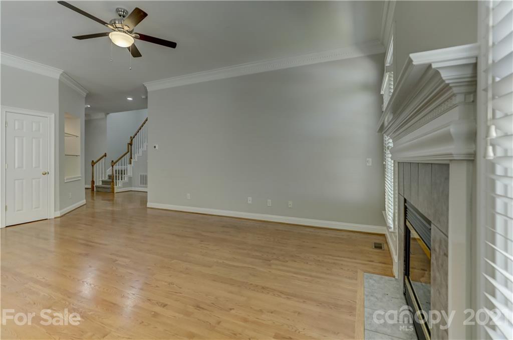 548 Glen Walk Drive Fort Mill, SC 29708 - Photo 15 of 48 a view of an empty room with a ceiling fan