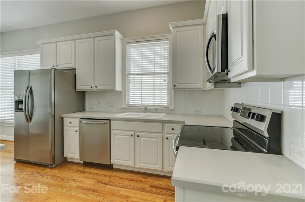 548 Glen Walk Drive Fort Mill, SC 29708 - Photo 20 of 48 a kitchen with stainless steel appliances granite countertop a refrigerator sink and cabinets
