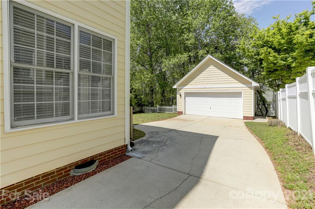 548 Glen Walk Drive Fort Mill, SC 29708 - Photo 40 of 48 a front view of a house with a yard and garage