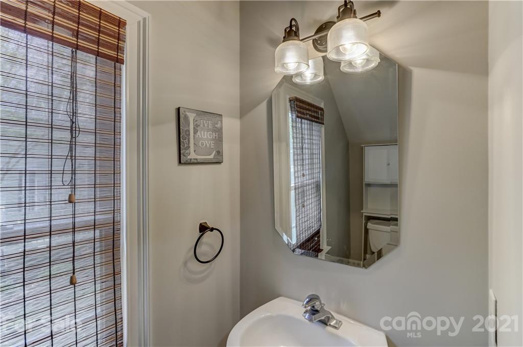 548 Glen Walk Drive Fort Mill, SC 29708 - Photo 42 of 48 a bathroom with a mirror and a sink