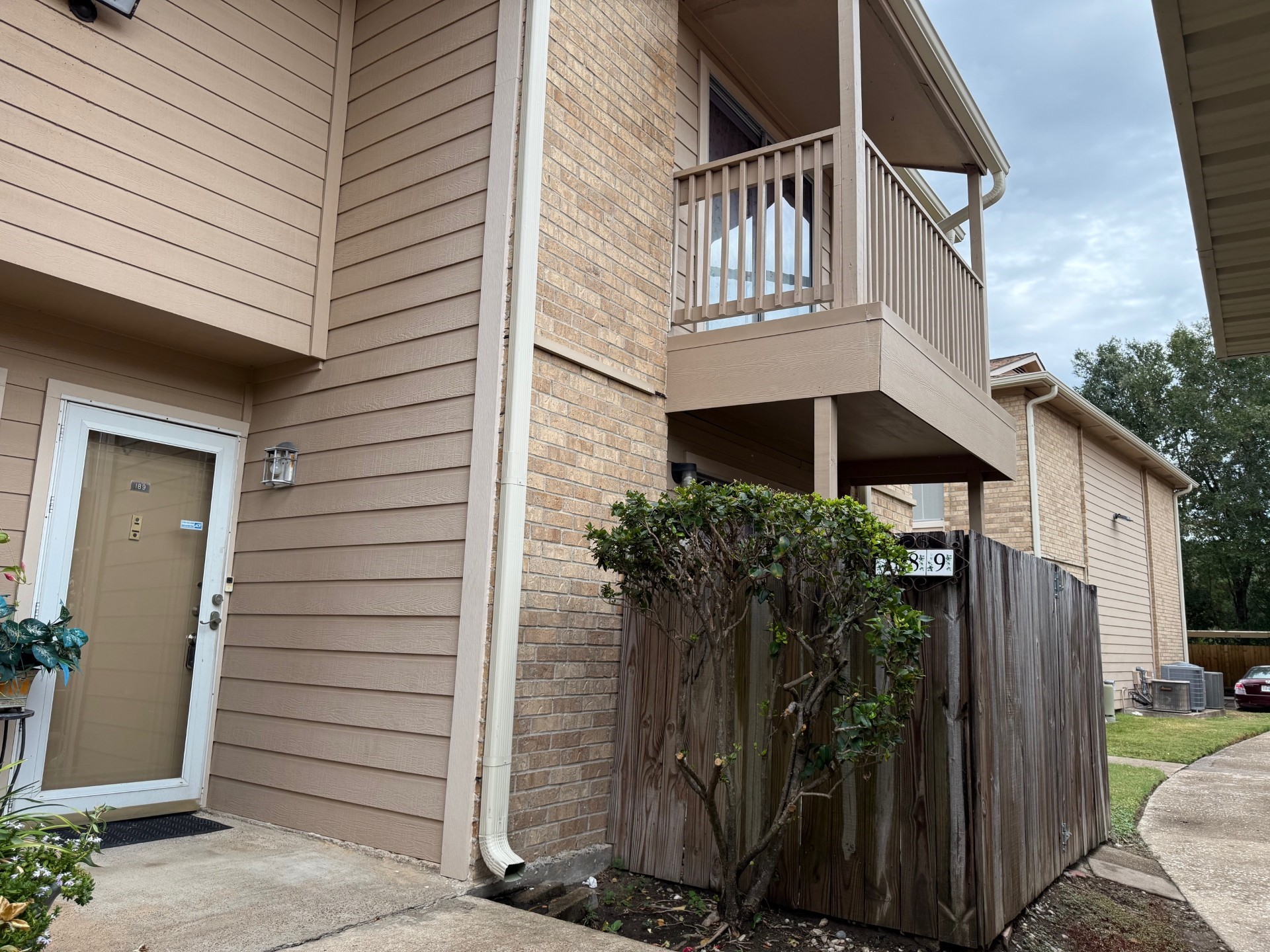 a view of front door and potted plants
