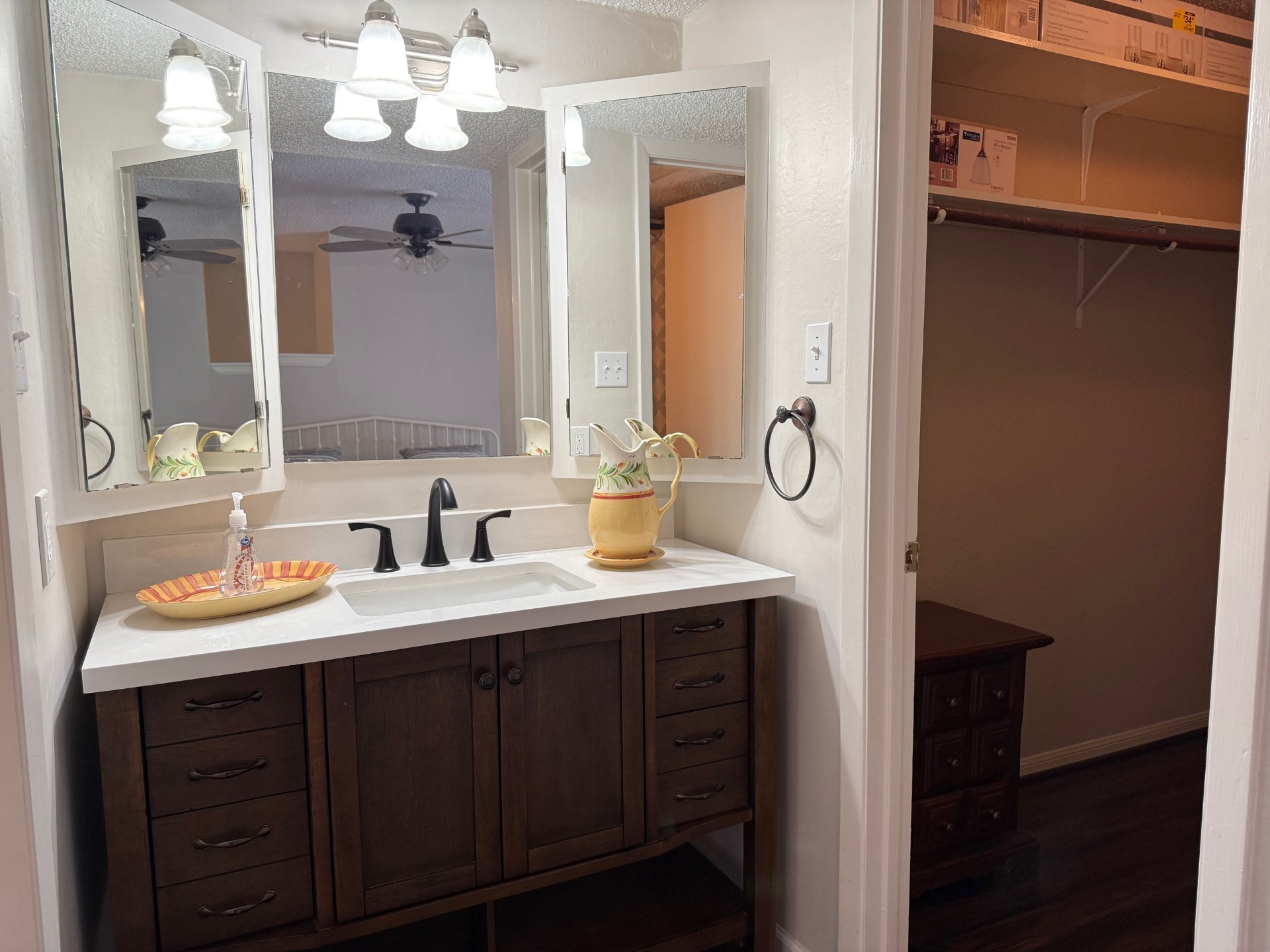 1505 Ward Road, Unit 189 Baytown, TX 77520 - Photo 12 of 14 a bathroom with a granite countertop sink a toilet and a mirror