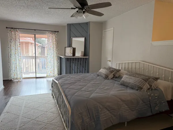 a bedroom with a bed and window