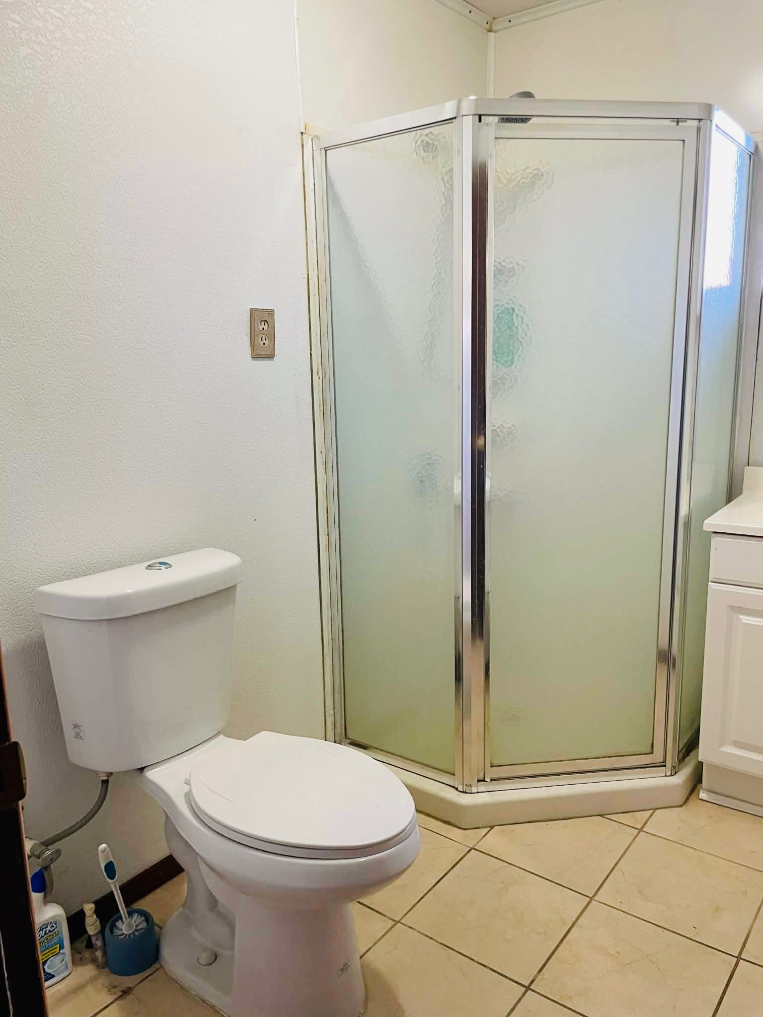 1825 Isom Street Houston, TX 77039 - Photo 23 of 27 a bathroom with a toilet and a shower