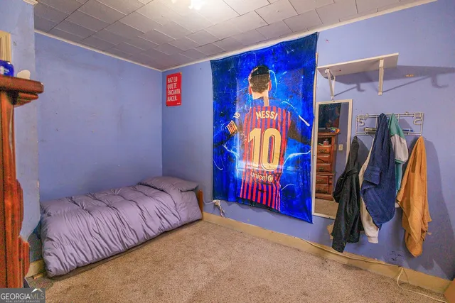 a bedroom with a bed and a walk in closet