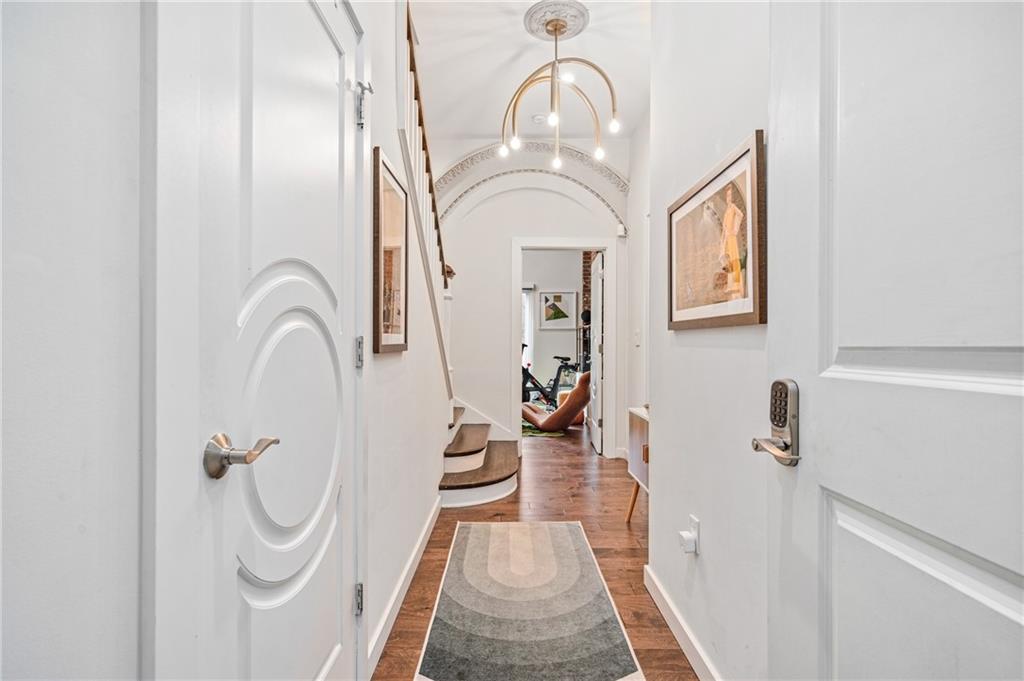 2132 Sarah Street, Unit 207 Pittsburgh, PA 15203 - Photo 4 of 50 Step into a bright, inviting entryway that hints at the stylish and spacious living areas beyond, featuring elegant hardwood floors and a modern aesthetic.