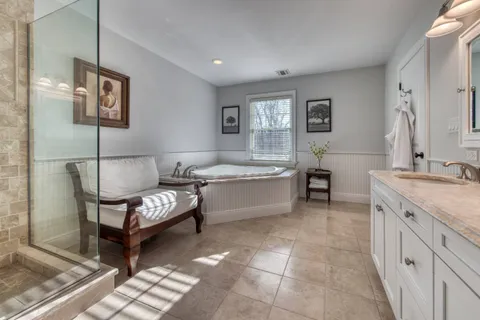a living room with furniture and a dresser