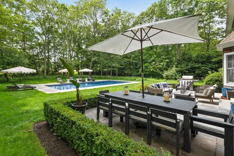 a view of a swimming pool with a patio