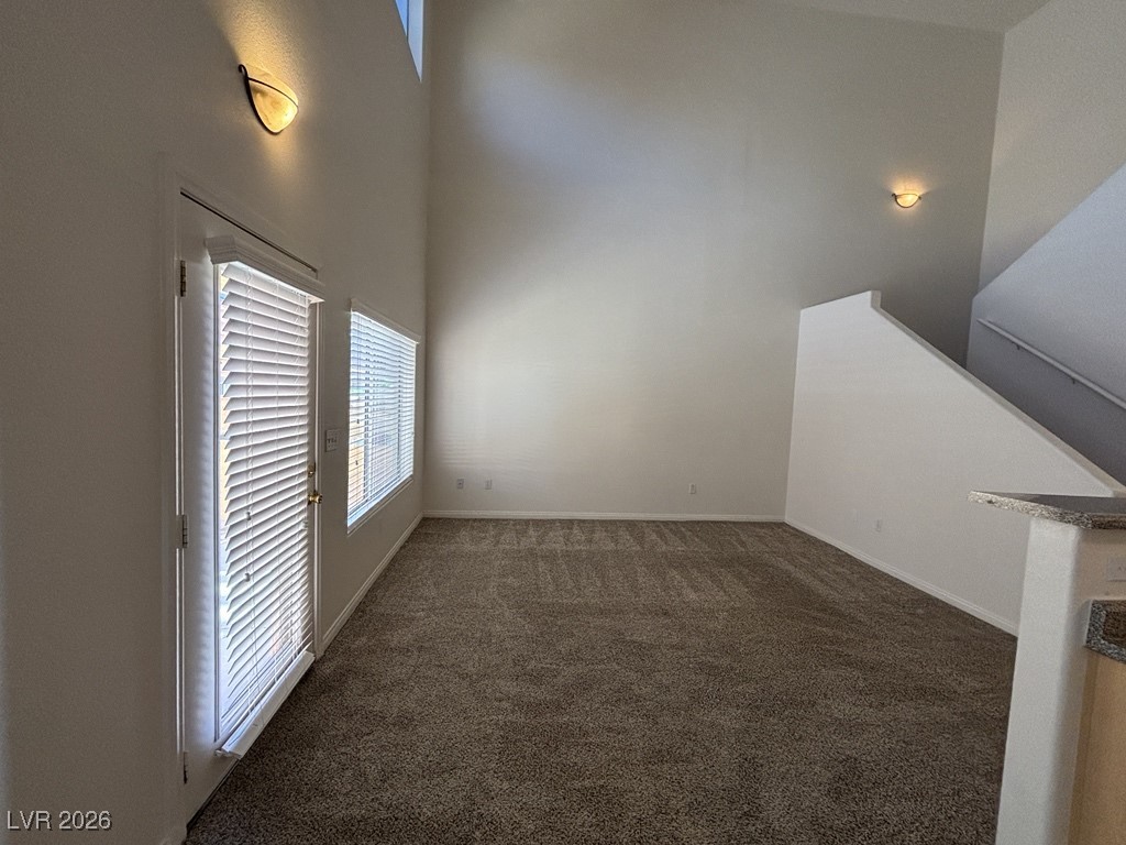 4915 East Russell Road, Unit 140 Las Vegas, NV 89120 - Photo 2 of 9 Living room with vaulted ceilings, and lots of natural light