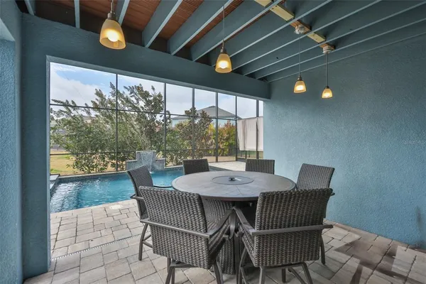 a view of a dining room with furniture window and outside view