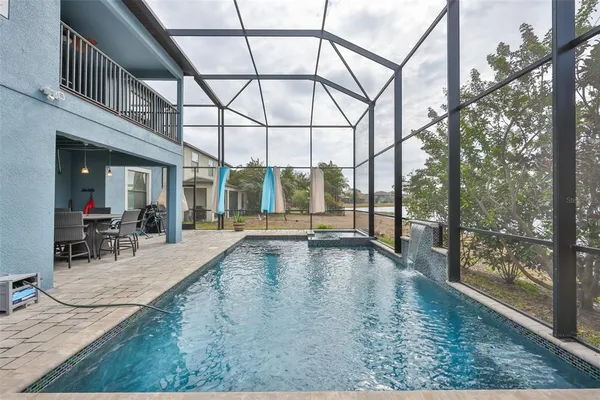 a view of swimming pool with outdoor seating