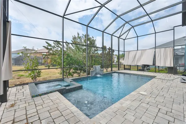 a view of a swimming pool with a porch