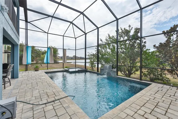 a view of a swimming pool with a yard