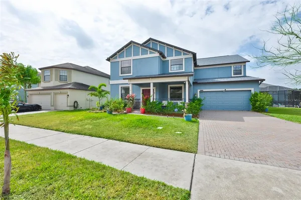 an aerial view of a house with a ocean view