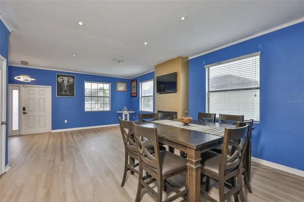 a view of a dining room with furniture and window
