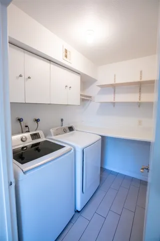 a kitchen with a sink a stove and cabinets