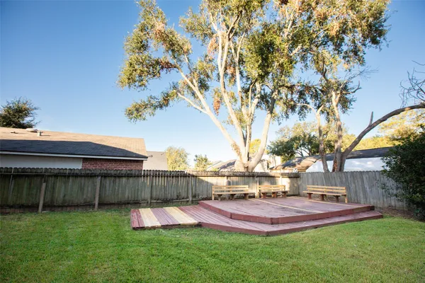 a view of yard with swimming pool and seating area