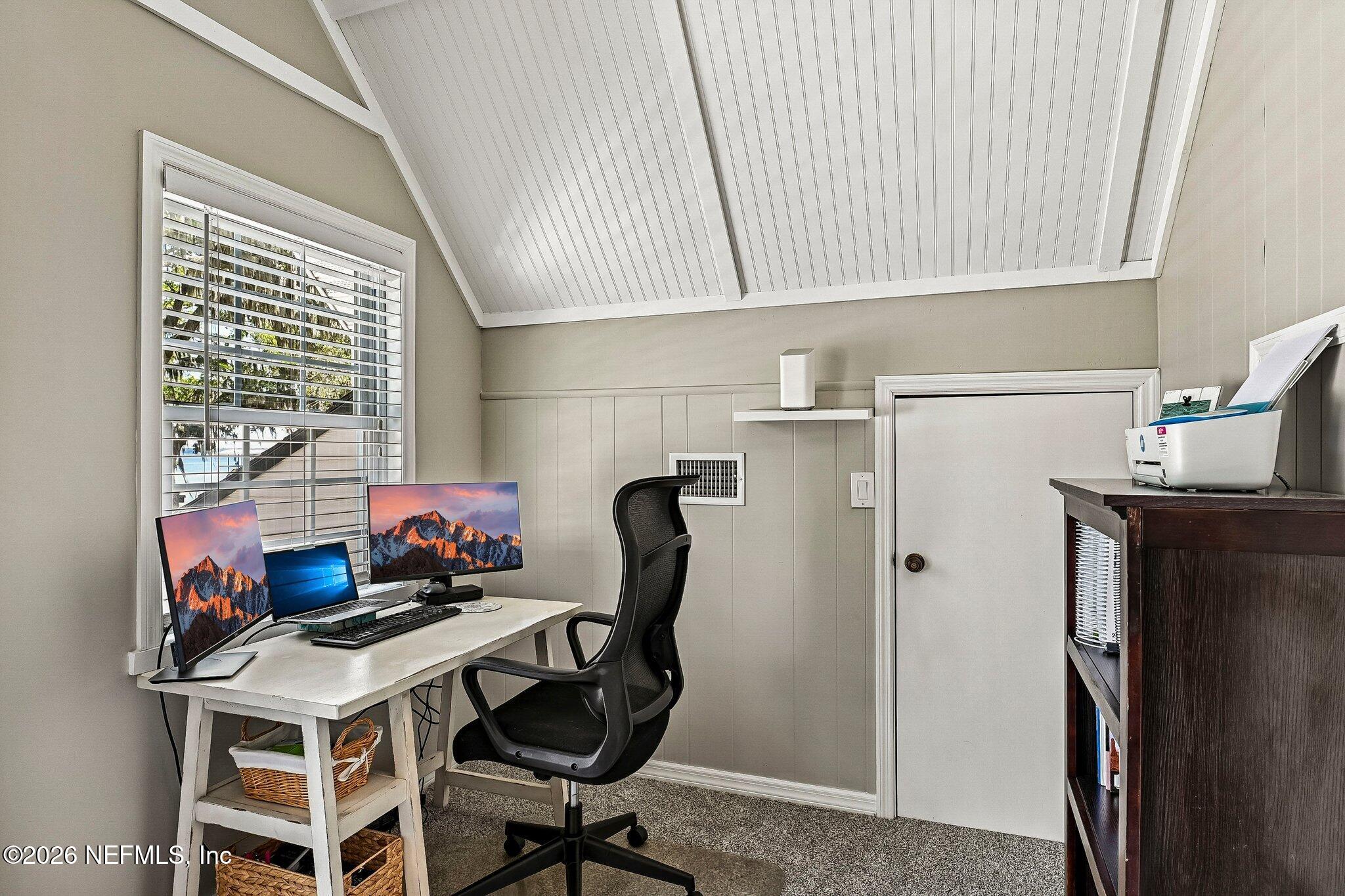 4745 Raggedy Point Road Fleming Island, FL 32003 - Photo 42 of 106 a view of a workspace with furniture and a window