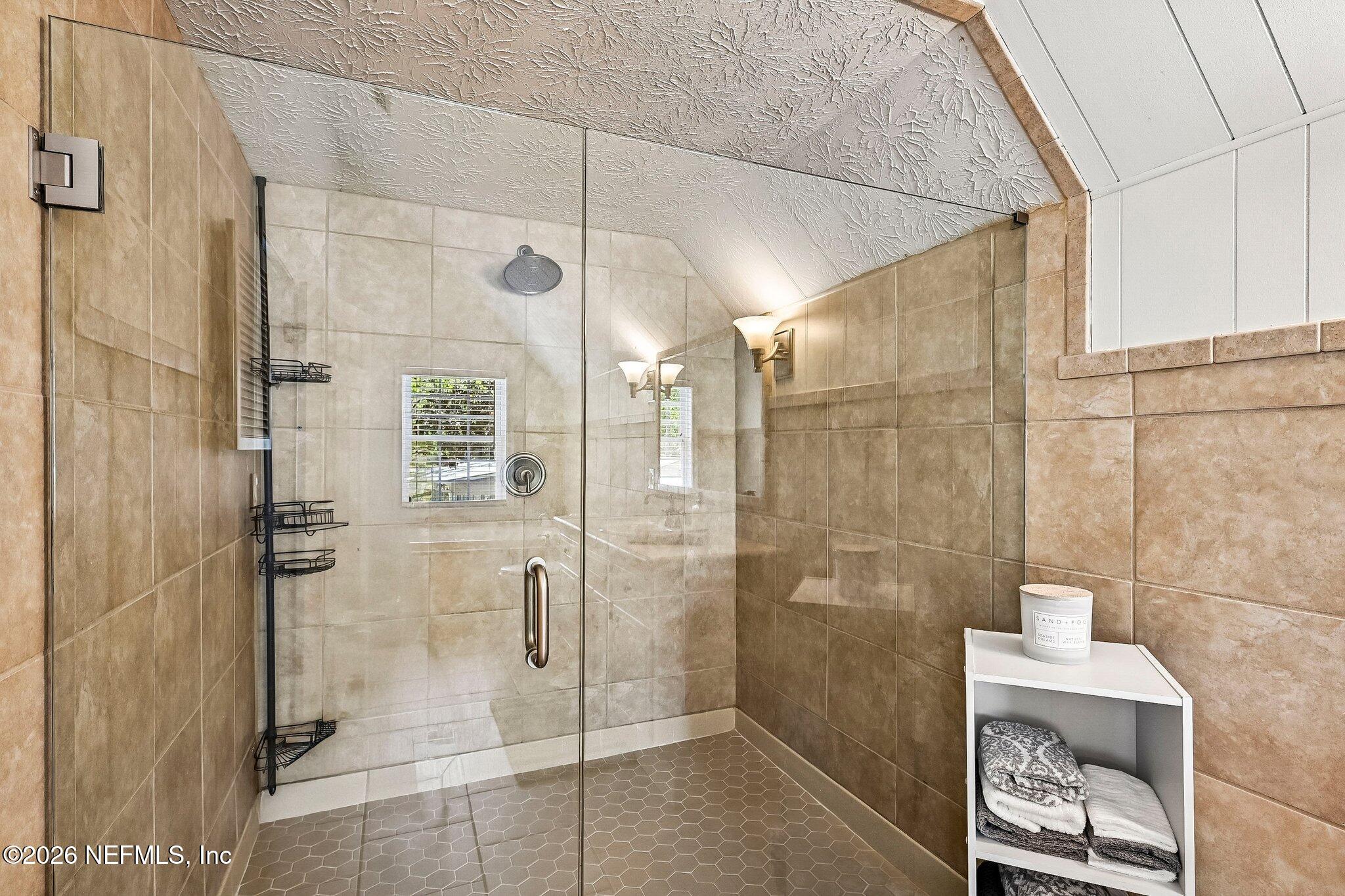 4745 Raggedy Point Road Fleming Island, FL 32003 - Photo 50 of 106 a bathroom with a shower and a sink
