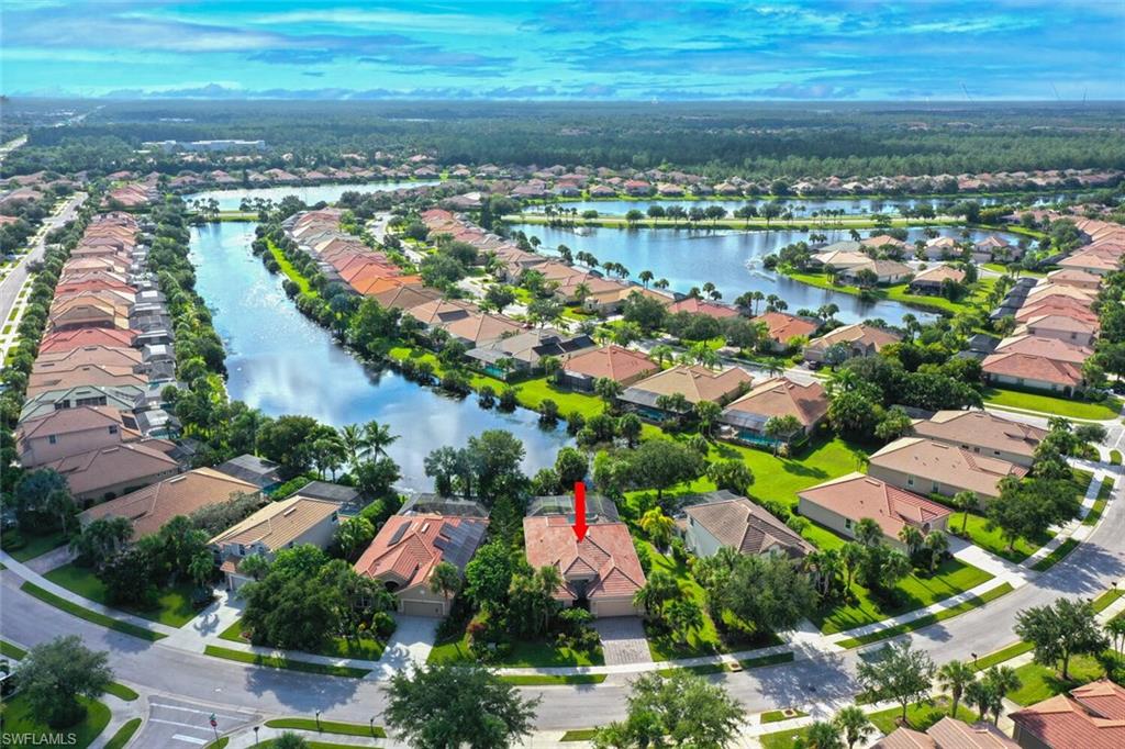 8237 Valiant Drive Naples, FL 34104 - Photo 1 of 35 Birds eye view of property featuring a water view