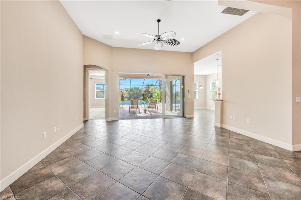 8237 Valiant Drive Naples, FL 34104 - Photo 14 of 35 Spare room featuring tile patterned floors and ceiling fan