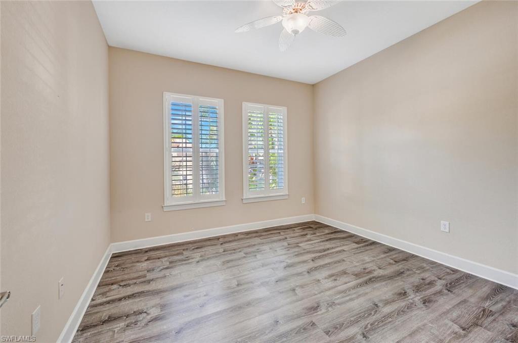 8237 Valiant Drive Naples, FL 34104 - Photo 22 of 35 Unfurnished room featuring light wood-type flooring and ceiling fan