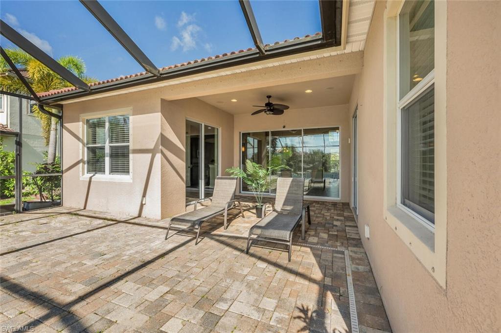 8237 Valiant Drive Naples, FL 34104 - Photo 27 of 35 View of patio / terrace with ceiling fan and glass enclosure