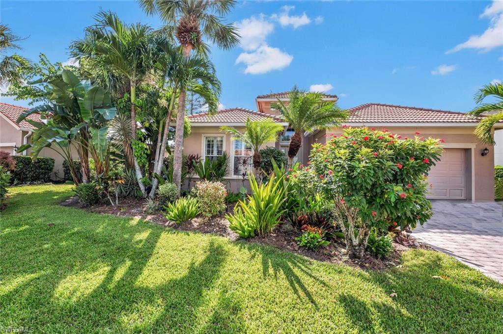 8237 Valiant Drive Naples, FL 34104 - Photo 3 of 35 Mediterranean / spanish house with a garage and a front lawn
