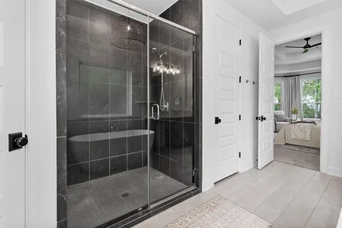 a bathroom with a glass shower door