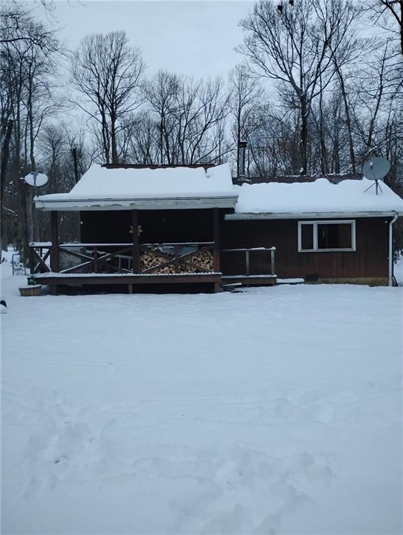 950 Springfield Road Penn Run, PA 15765 - Photo 13 of 16 a front view of house with yard and trees in the background