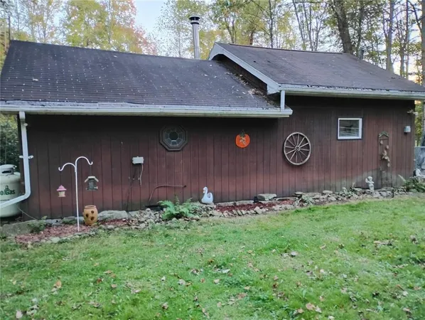 a view of a patio with table and chairs