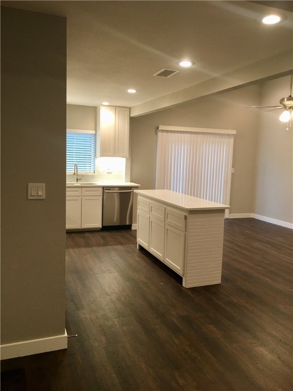 8307 Renton Drive Austin, TX 78757 - Photo 3 of 8 a room with wooden floors and white walls
