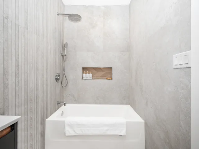 a bathroom with a white bath tub