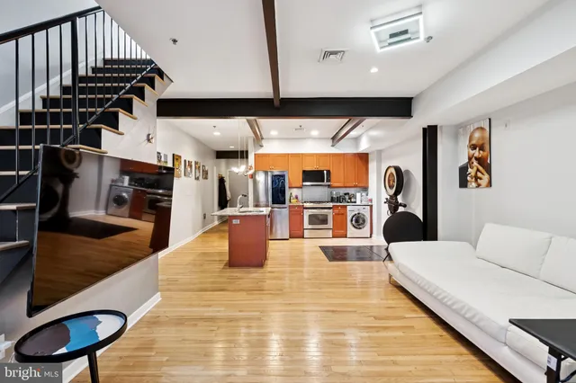 a living room with lots of furniture and a flat screen tv