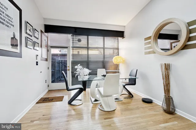 a work room with furniture and wooden floor