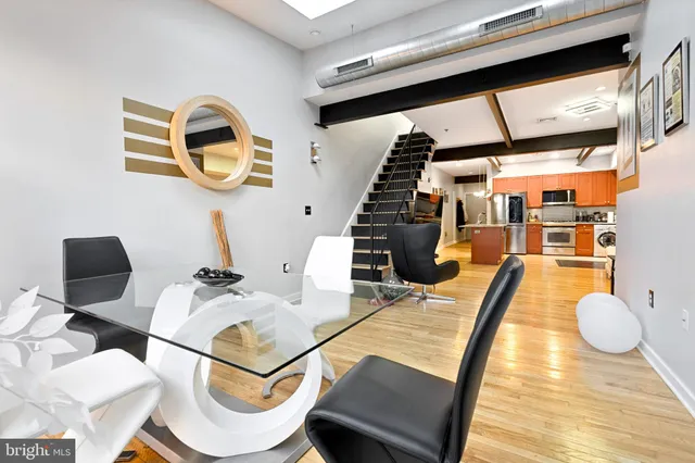 a bedroom with furniture and a large window